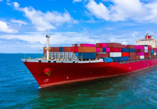 Container cargo ship carrying container for business freight import and export, Aerial view container ship arriving in commercial port.